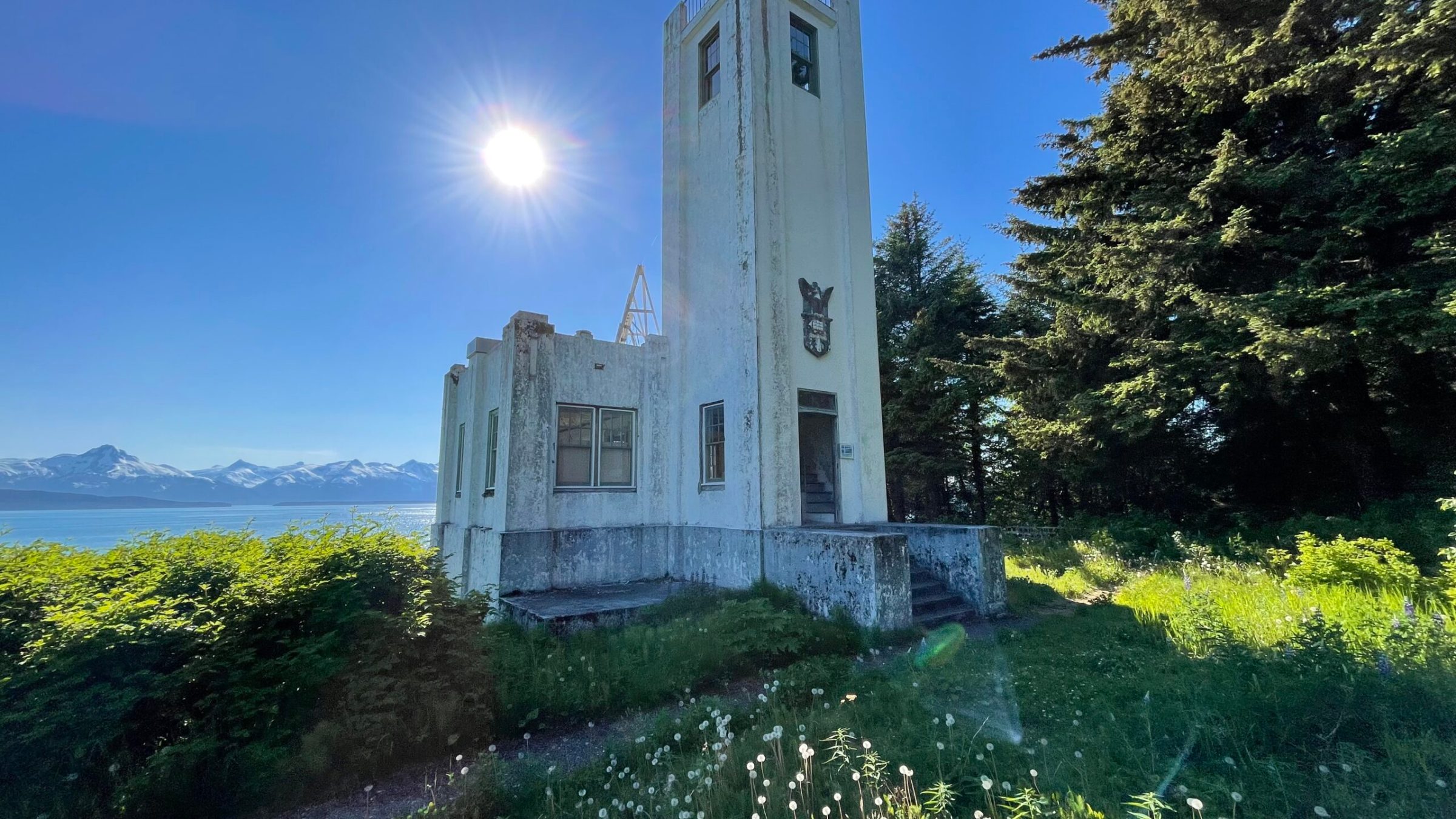 a tall clock tower sitting next to a body of water